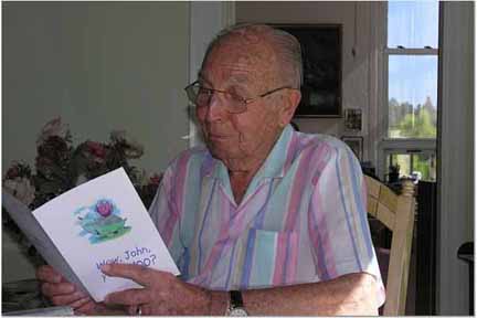 John reading his birthday cards.